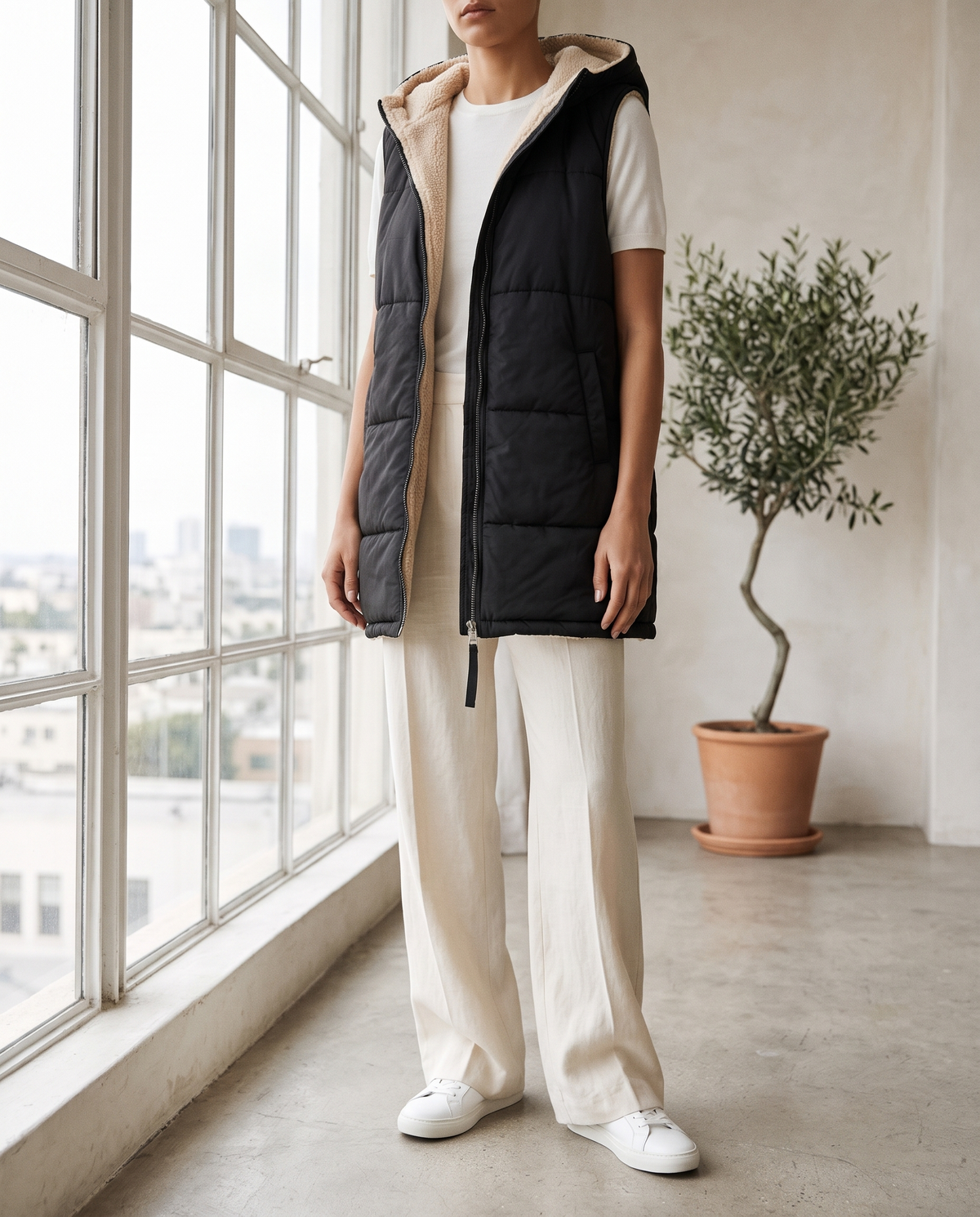 Sigrun women's sleeveless hooded woven jacket - Black styled with wide-leg trousers