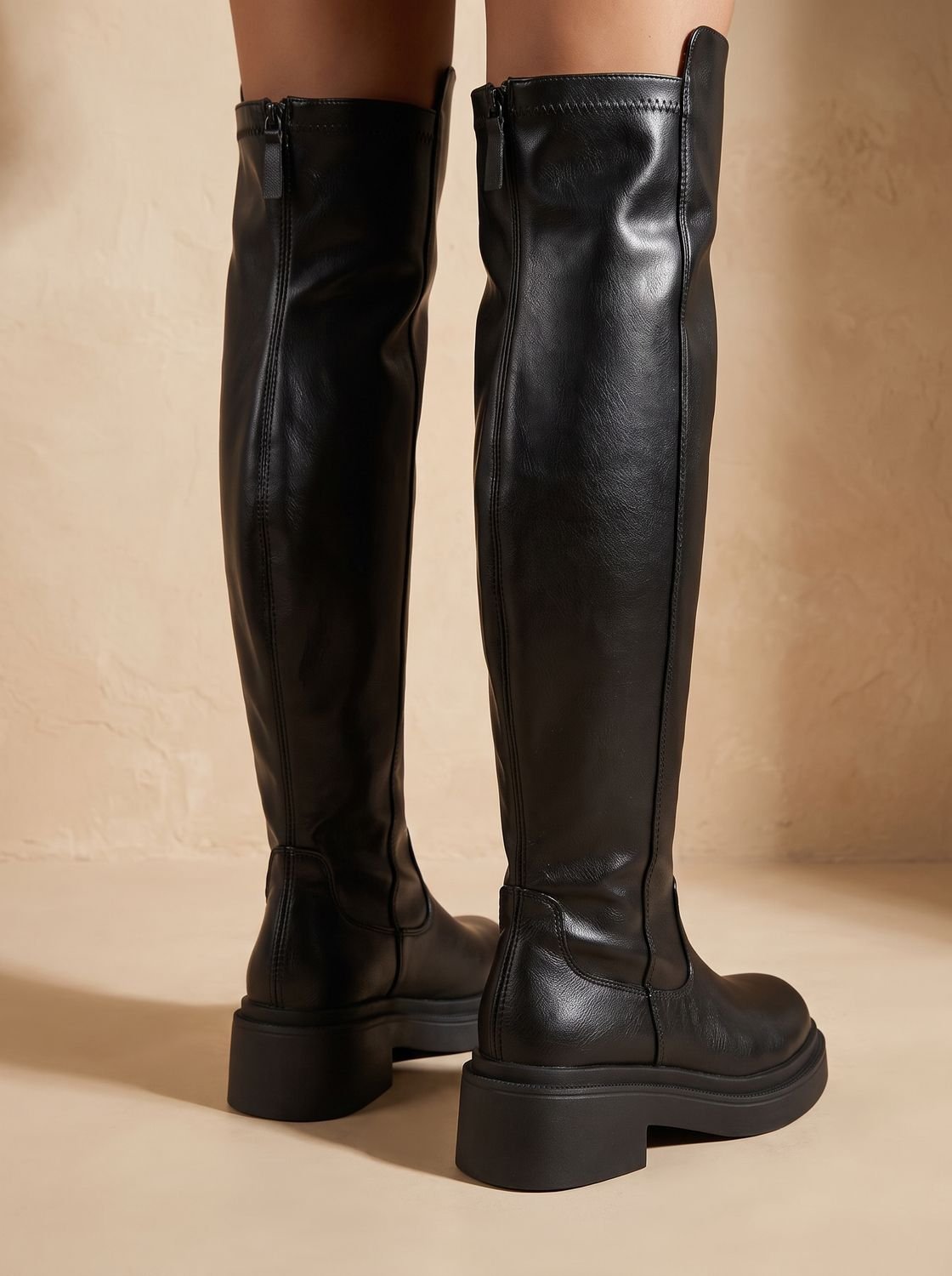 Chunky over-the-knee boots in black or brown for women