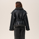 Belted shearling-look aviator jacket in black for women