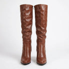 Curved heel knee high boots for women