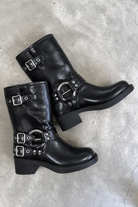 Black mid-calf harness buckle biker boots for women