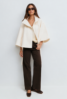 Stand collar cape style belted coat for women