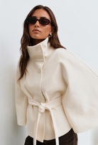 Stand collar cape style belted coat for women