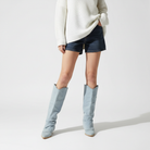Light blue denim pointed toe knee-high slouch boots for women