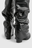 Pointed toe knee-high slouch boots for women