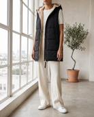 Sigrun women's sleeveless hooded woven jacket - Black styled with wide-leg trousers