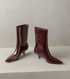 Curved kitten heel ankle boots for women