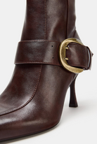 Buckled pointed toe knee-high boots for women