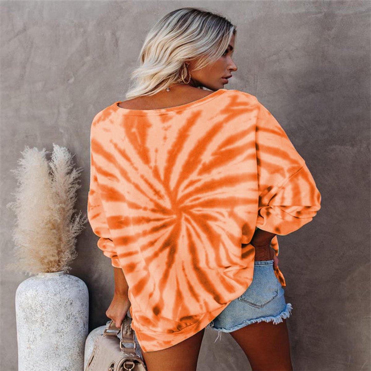 Tie-dye pumpkin face sweatshirt in orange for women