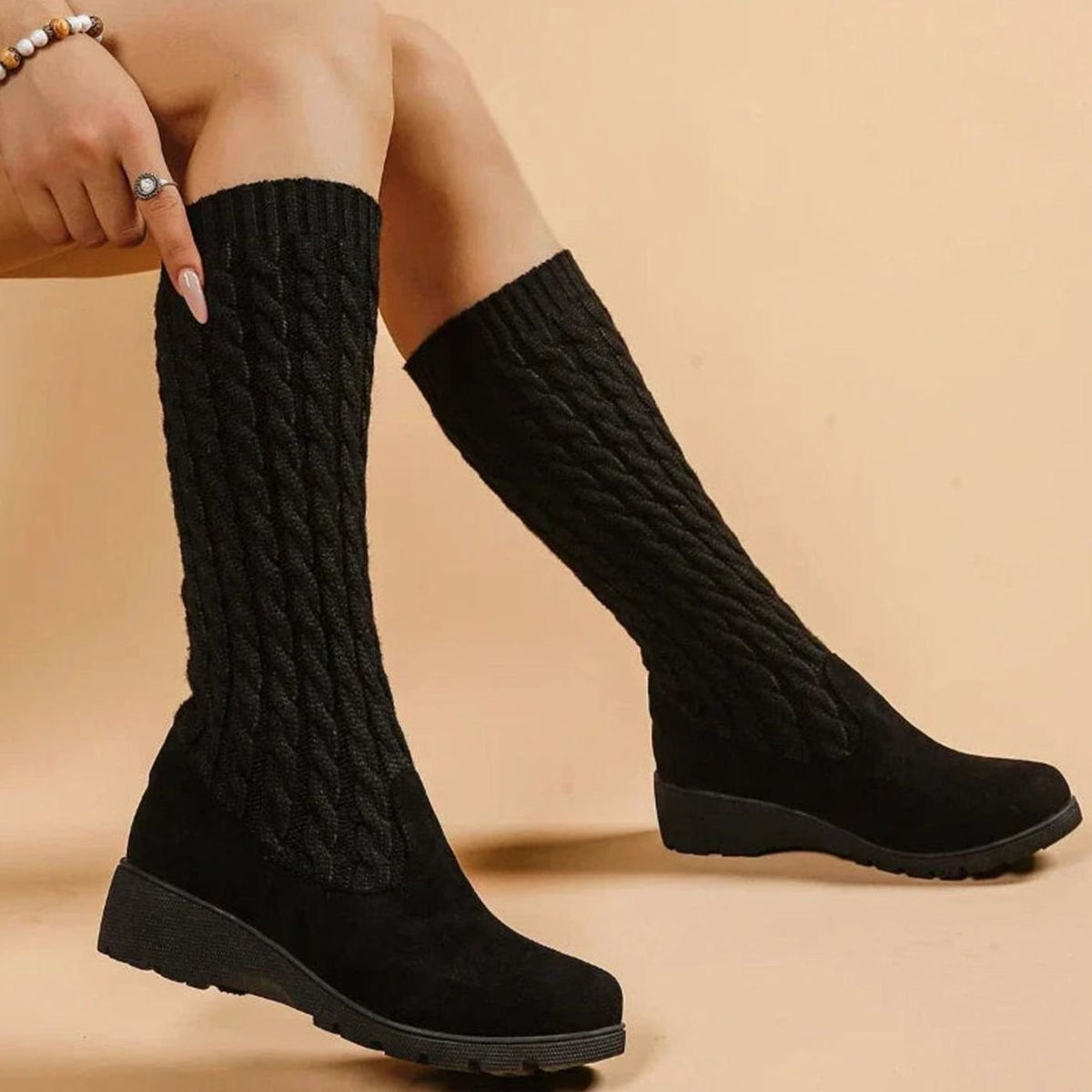 Cable knit knee-high boots in black for women