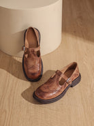 Wingtip buckle T-strap flats for women